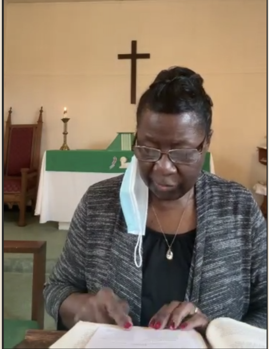 Lector reading from the Bible during service